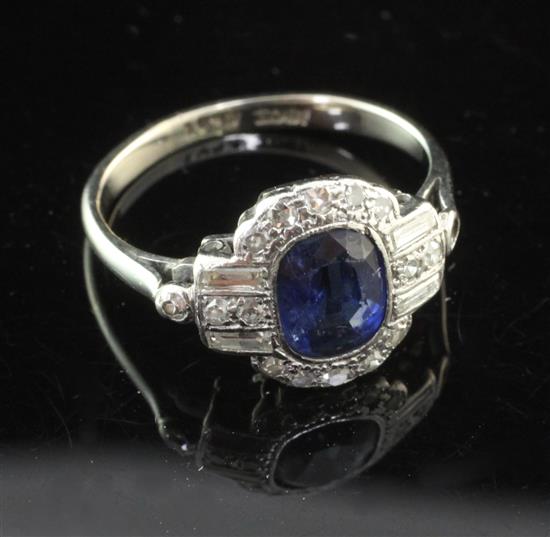 A 1930s Art Deco 18ct white gold and platinum, sapphire and diamond cluster ring, size K.